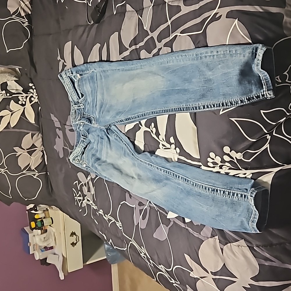 A pair of Miss Me skinny jeans